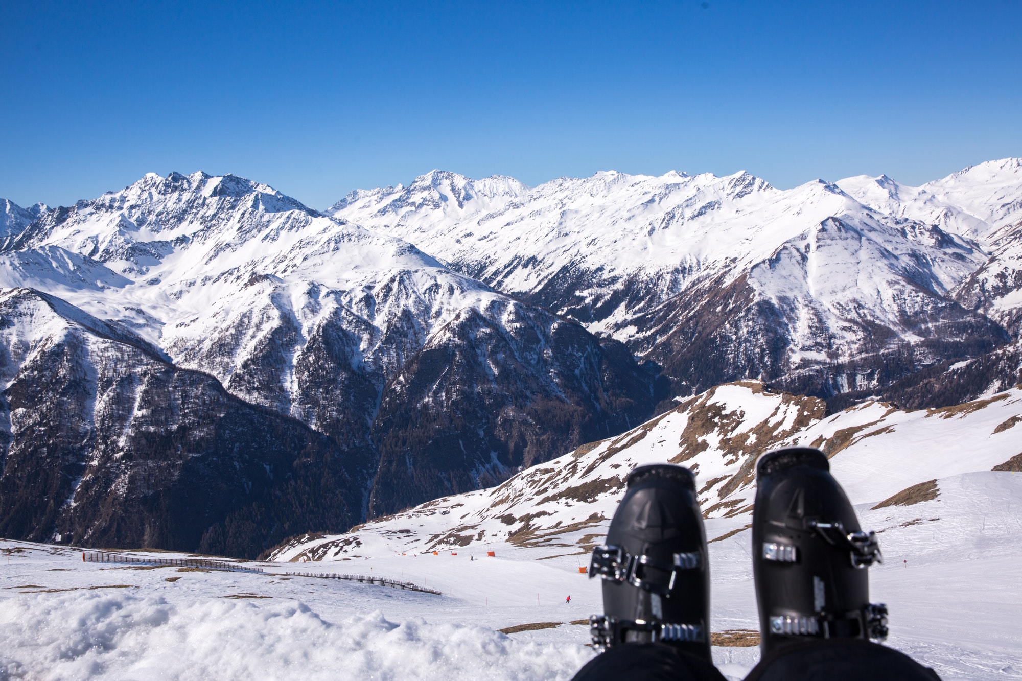 Feet selfie of skier resting and enjoying the view of mountains. Austria, Alps